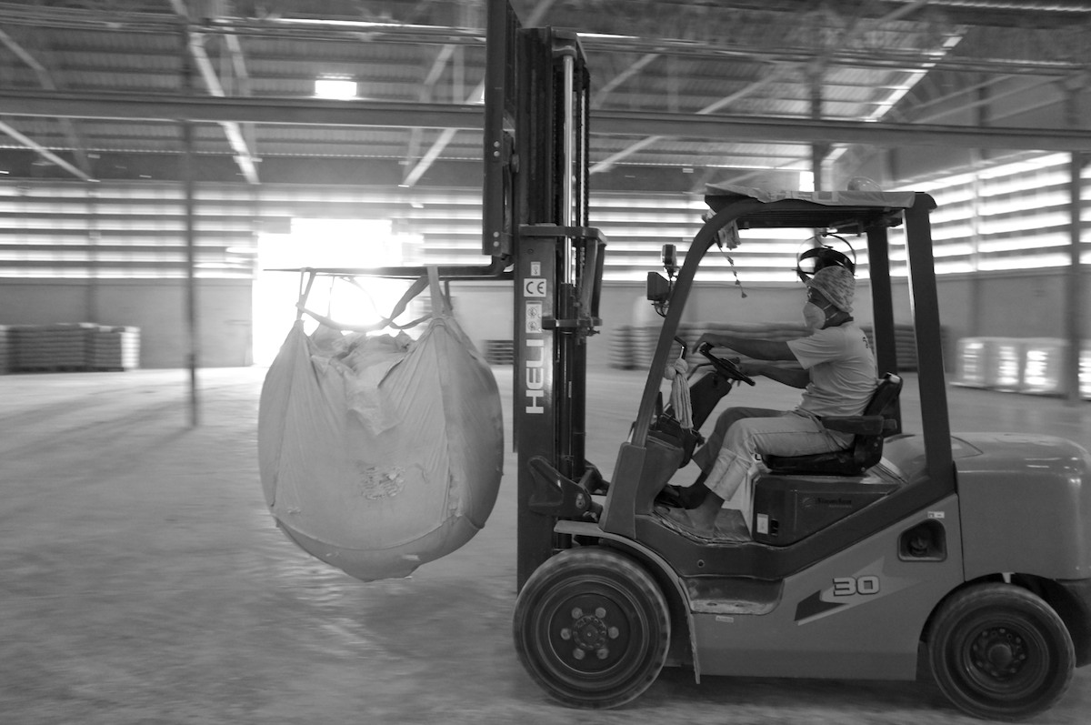 With a recent shipment of kaolin having gone out, the forklift driver has ample room to enjoy a little sliding while transporting the bags ready for shipment.